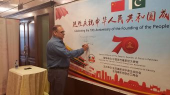 Mr. Hassan Daud Butt, CEO, KP-BOIT signing at the official event to celebrate the begginning of Chinese 70 years celebration